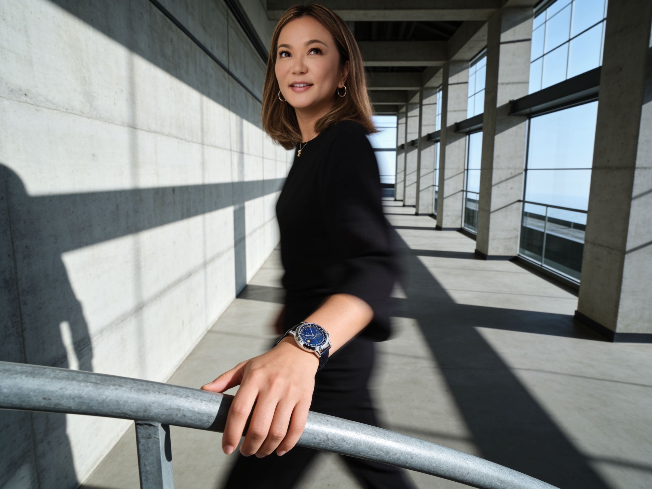 Lifestyle portrait in motion along a sunlit concrete corridor, blue dial watch in sharp focus on the wrist